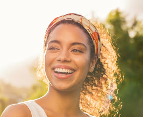 smiling woman in sunlight