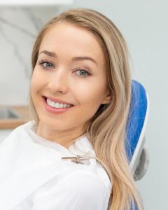 woman in dental chair smiling 