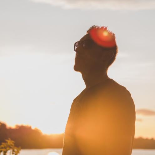 man smiling in low sunlight