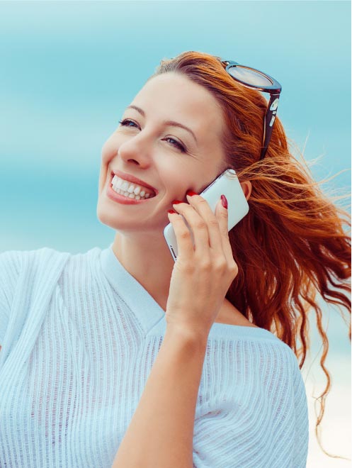 woman smiling on the phone