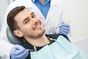 man getting a dental exam