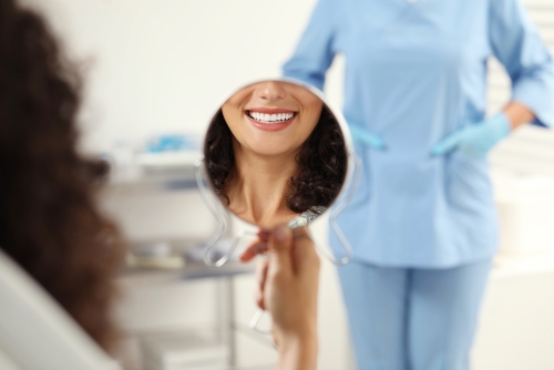 Patient,Looking,In,Mirror,And,Doctor,In,Clinic,,Selective,Focus.