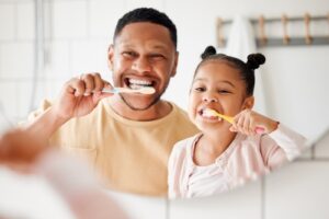 Child,,Dad,And,Brushing,Teeth,In,A,Family,Home,Bathroom